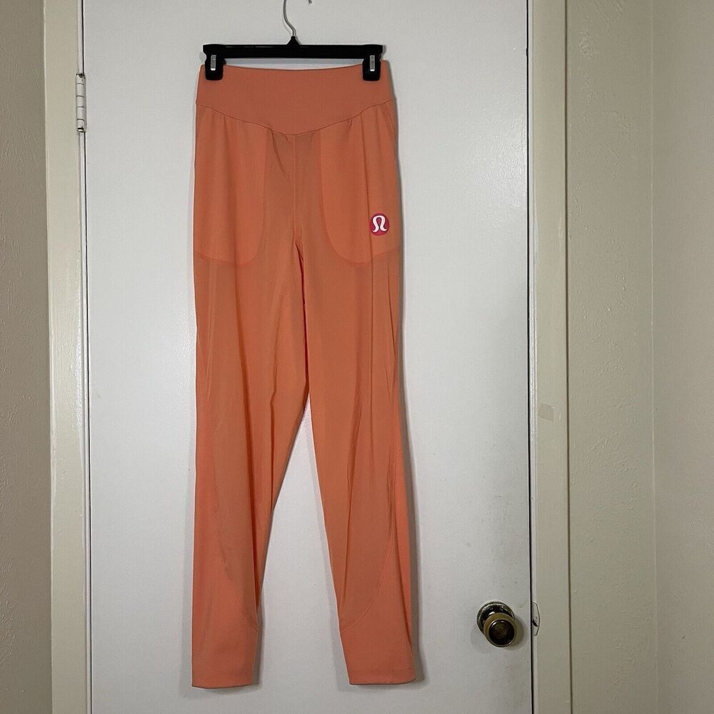 LULULEMON orange peach lightweight magnetic slit hem jogger pants 4